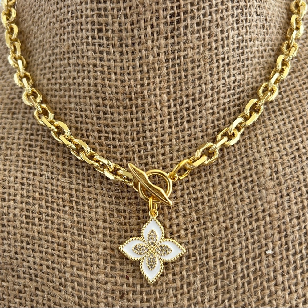 Gold Chain Necklace with White Floral Pendant.